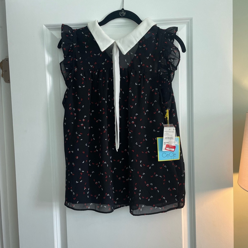 CeCe Black Top with White and Red Floral Accents